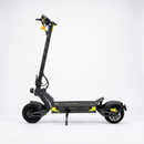 A black electric scooter with bright yellow accents, shown from a side profile view against a clean white studio background. The brand name 'DriveTron' is visible on the deck and handlebar area.